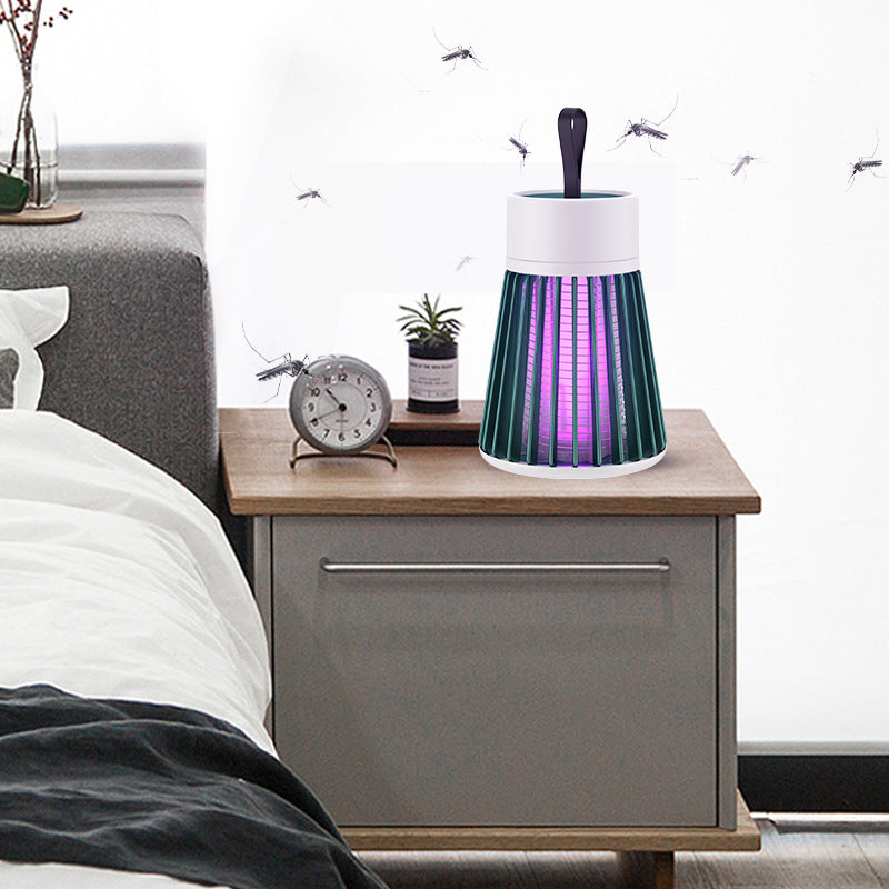 Electric Mosquito Killer Lamp on a nightstand with mosquitoes around, next to a bed and alarm clock.