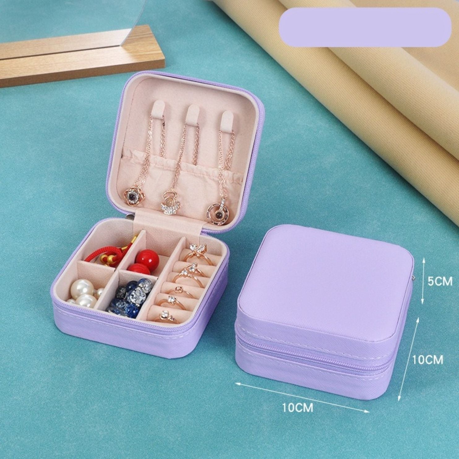 Light Purple jewelry box with compartments on a blue background