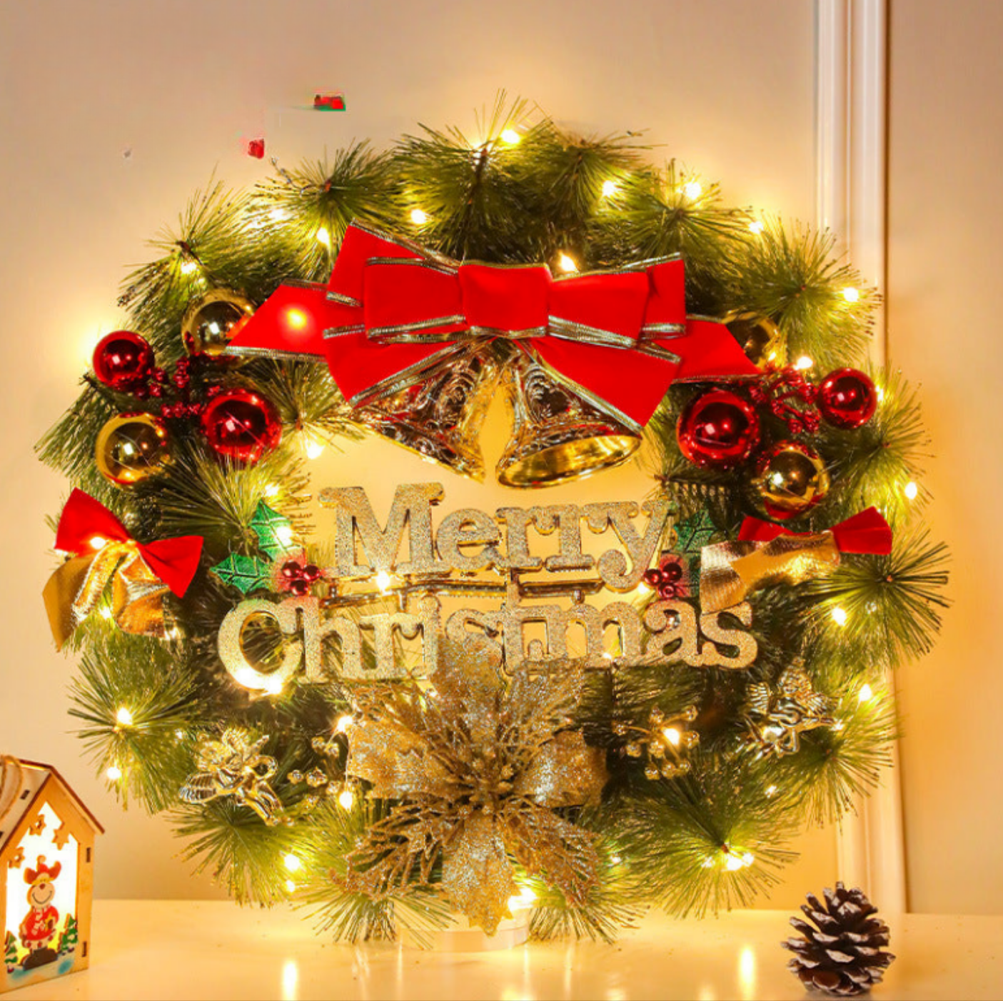 Decorative Christmas wreath with lights, ornaments, and 'Merry Christmas' text.