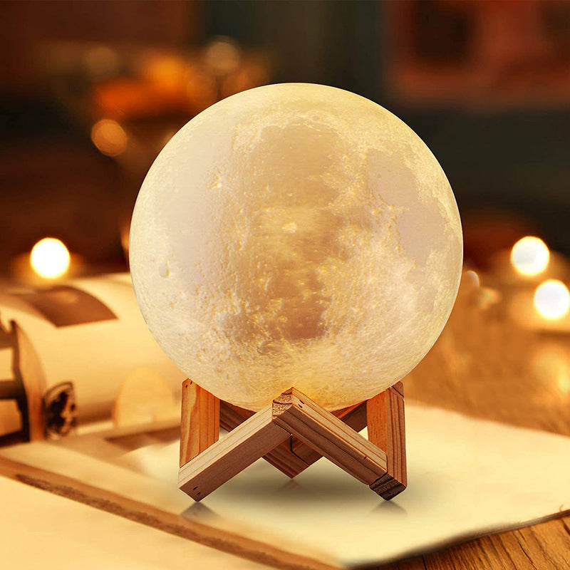 Moon lamp on a wooden stand with a blurred background