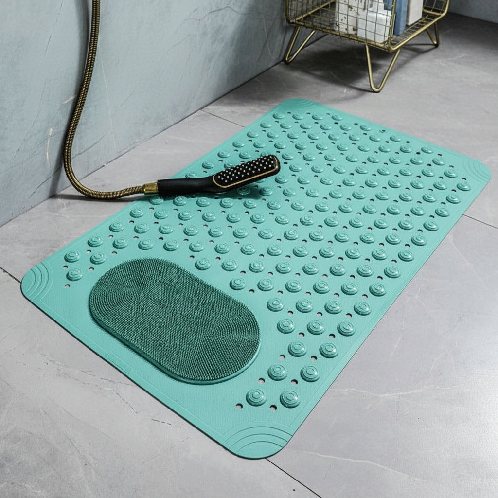 Green bath mat with textured surface on a bathroom floor.