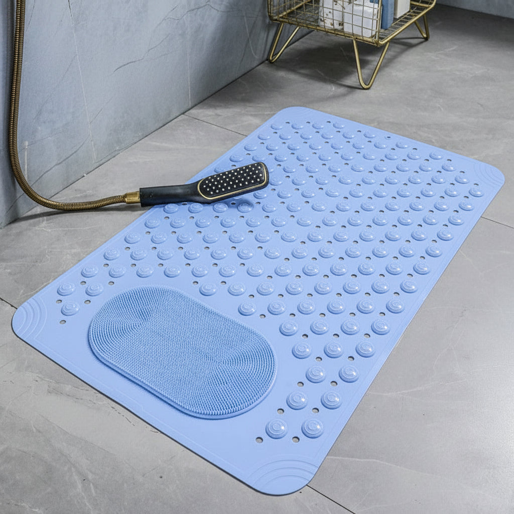 Light blue bath mat with textured surface on a gray floor, accompanied by a shower head.