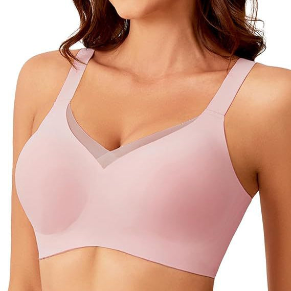 Woman wearing a pink bra on a white background