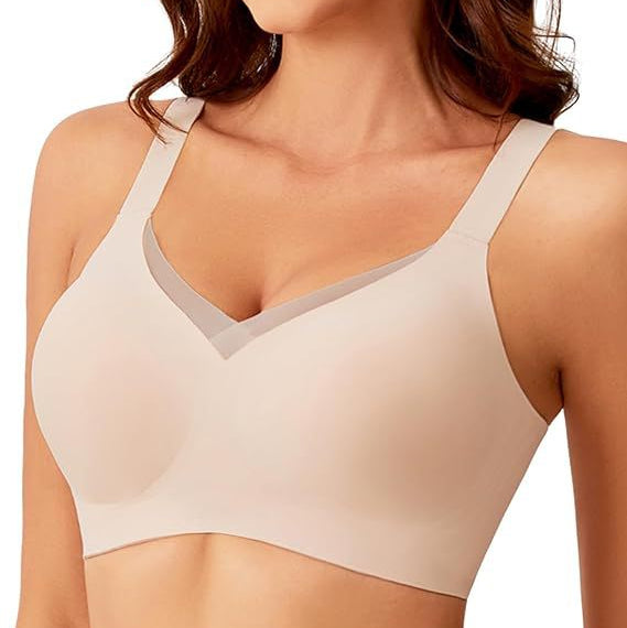 Woman wearing a beige bra on a white background