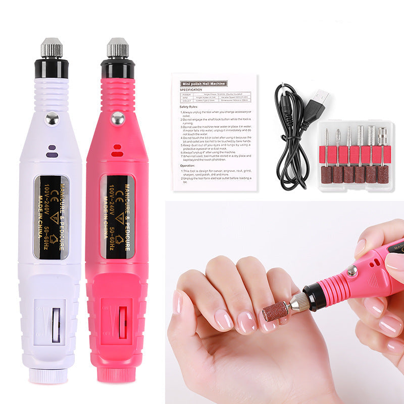 Nail drill machine with accessories on a white background