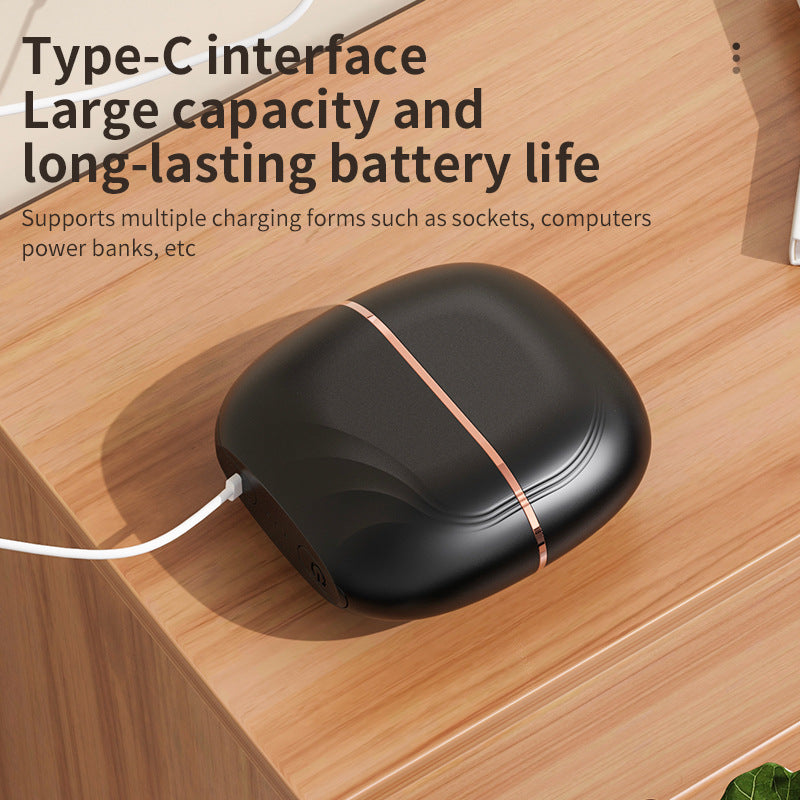 Black power bank with Type-C interface on a wooden surface