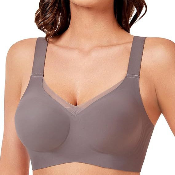 Woman wearing a gray bra on a white background