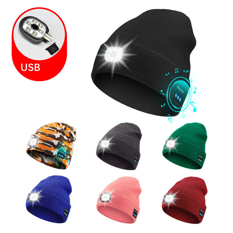 Black beanie with USB light feature, surrounded by other colored beanies on a white background.