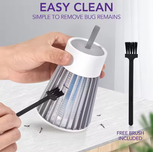 Cleaning tool with a free brush included, shown being used to remove bug remains from a surface.
